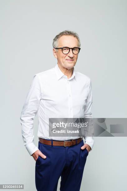 portrait of friendly senior businessman - man white studio shot collared shirt stock pictures, royalty-free photos & images