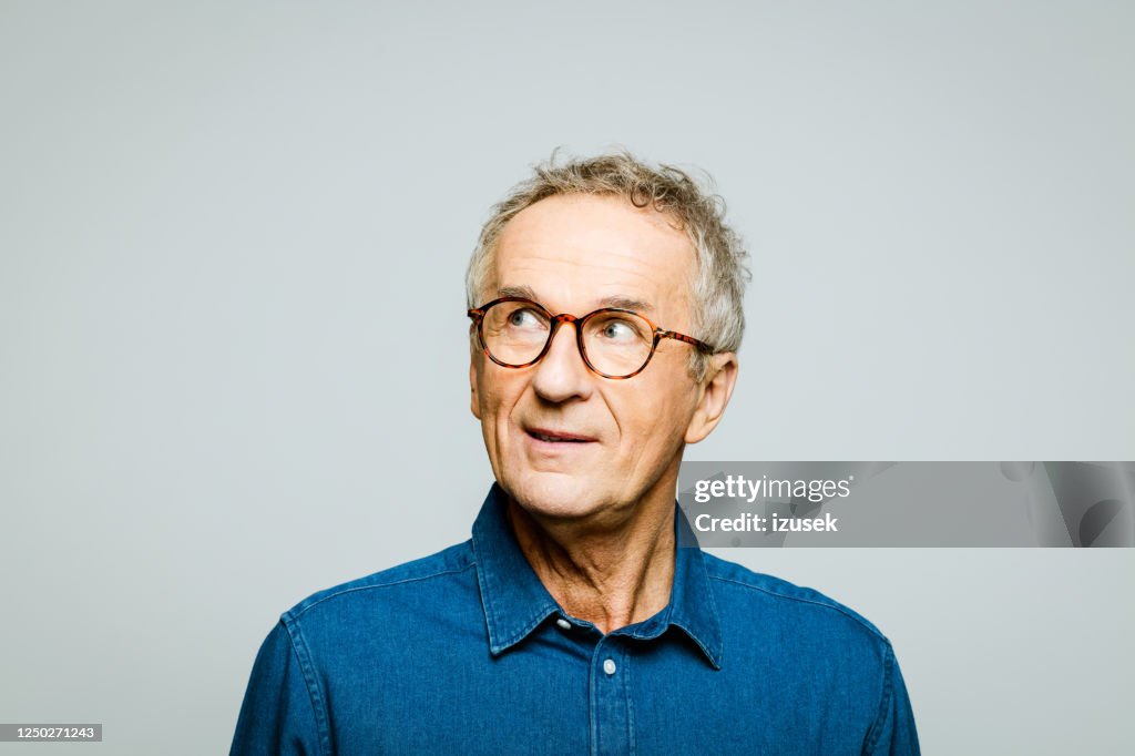 Headshot of thoughtful senior man