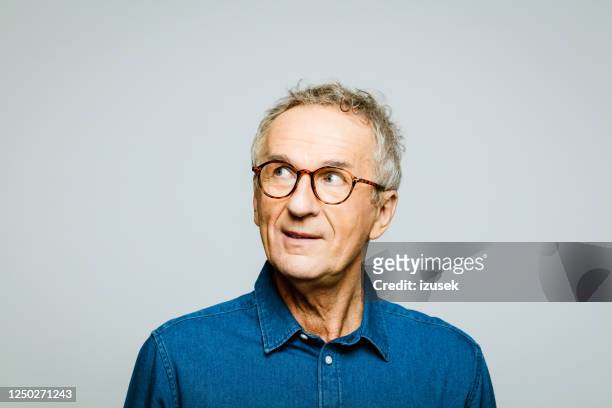 headshot of thoughtful senior man - disbelief stock pictures, royalty-free photos & images