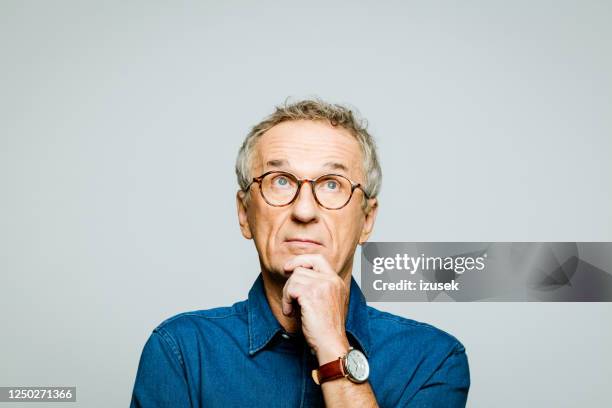 headshot of thoughtful senior man - reflection stock pictures, royalty-free photos & images