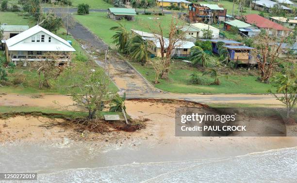 This aerial view shows a buildings and vegetation damaged after Cyclone Yasi hit the Queensland coastal area of Mission Beach on February 3, 2011....