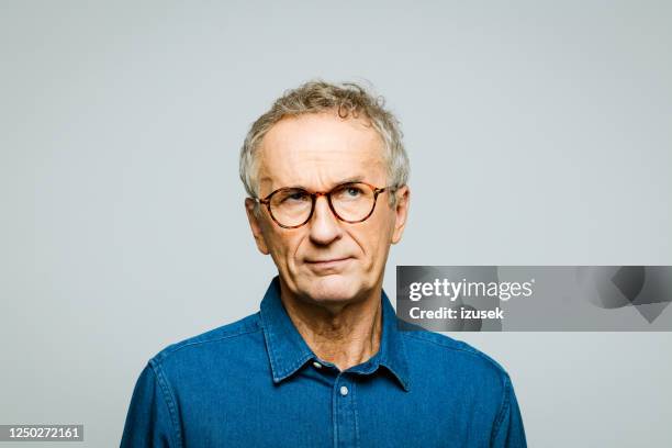 headshot of worried senior man - asking face stock pictures, royalty-free photos & images