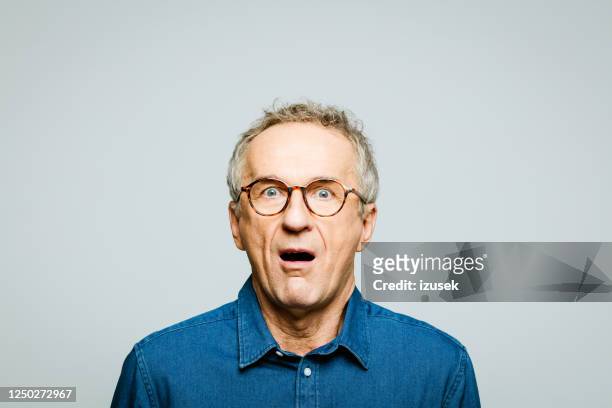 portrait of shocked senior man - horror stock pictures, royalty-free photos & images
