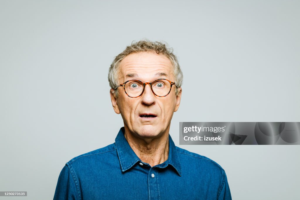 Portrait of surprised senior man