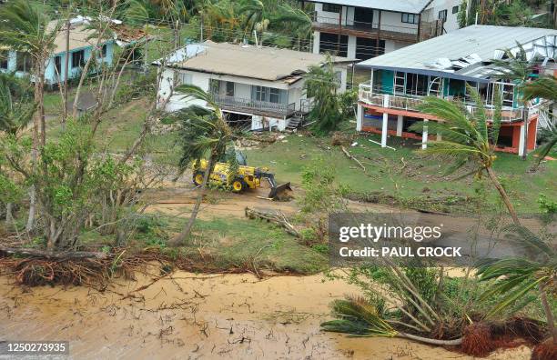 This aerial view shows buildings and vegetation damaged after Cyclone Yasi hit the Queensland coastal area of Mission Beach on February 3, 2011....