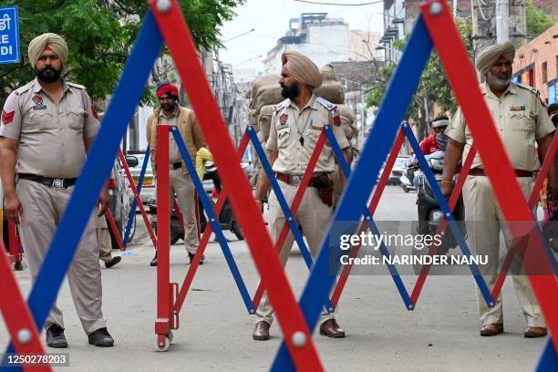 Punjab police control traffic on way to the Golden Temple in Amritsar on April 1, 2023.