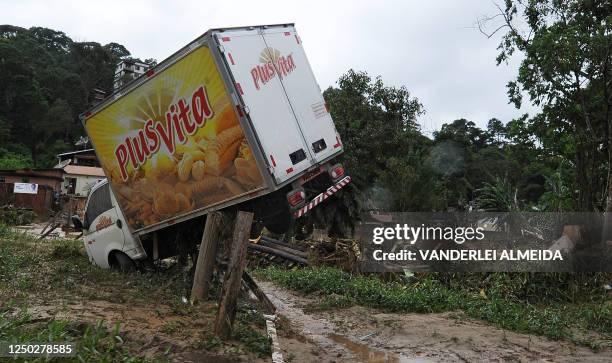Delivery truck is seen stuck among wreckage caused by landslides and flooding in Teresopolis, some 100 km from downtown Rio de Janeiro, Brazil on...