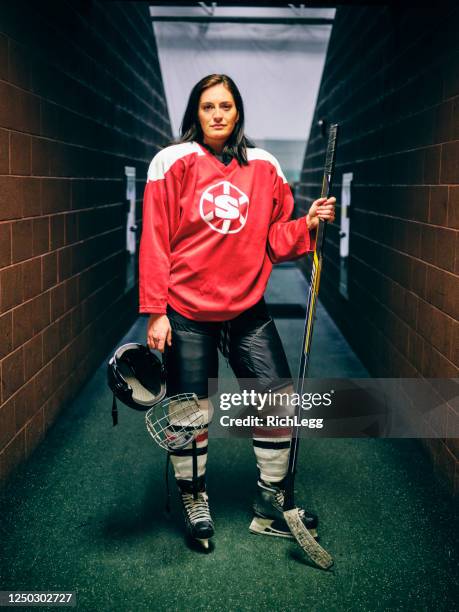 woman hockey player - hockey jersey stock pictures, royalty-free photos & images