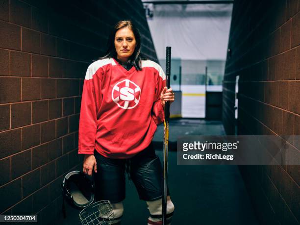 woman hockey player - hockey jersey stock pictures, royalty-free photos & images