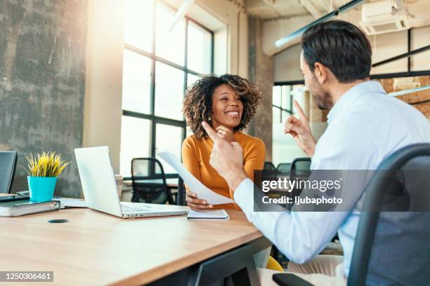 preparing for their client pitch - 2 people smiling stock pictures, royalty-free photos & images