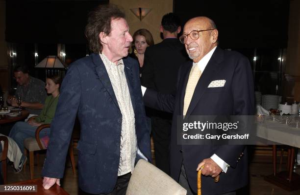 View of Rock musician Jack Bruce and Atlantic Records President and co-founder Ahmet Ertegun as they talk during an after-party at the Four Seasons...