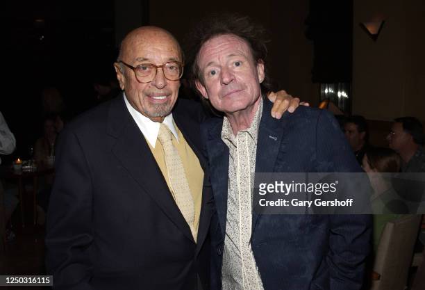 View of Atlantic Records President and co-founder Ahmet Ertegun and Rock musician Jack Bruce as they pose together during an after-party at the Four...