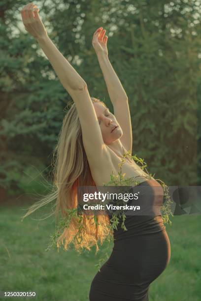 young women in nature - woman little black dress stock pictures, royalty-free photos & images