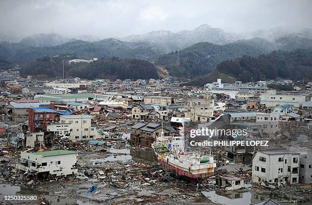 Damage caused by the March 11 tsunami is seen from a hill overlooking the city of Kesennuma on March 16, 2011. Japan's Emperor Akihito delivered a...
