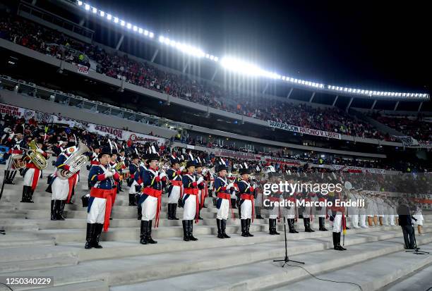 Argentina's Army bands perform as part of the commemorations to the Argentine veterans and fallen in the Malvinas Islands prior a match between River...