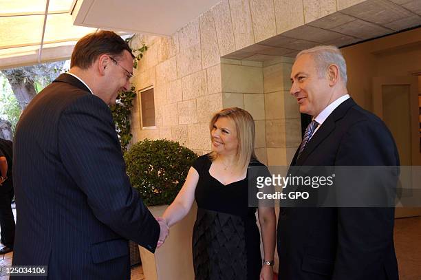 In this handout image supplied by the Israeli Government Press Office , Israeli Prime Minister Benjamin Netanyahu and his wife Sara greet Czech Prime...