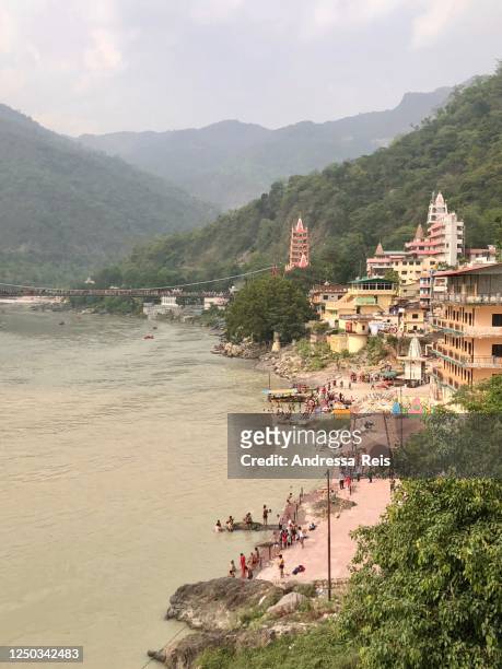 ganga river and daily hindu life at rishikesh - rishikesh stock pictures, royalty-free photos & images