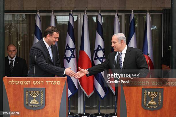 Israeli Prime Minister Benjamin Netanyahu shakes hand with his counterpart Czech Prime Minister Petr Necas during a joint press conference at...