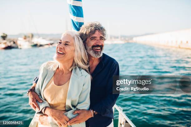 seniors in love enjoying their romantic cruise vacation - navio de passageiros imagens e fotografias de stock