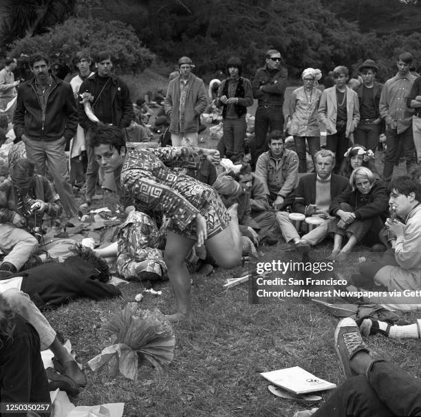 Hippies of the Haight Ashbury celebrate the Summer Solstice in Golden Gate Park, June 21, 1967. Trina Matthews dances to the music.