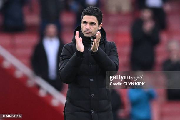 Arsenal's Spanish manager Mikel Arteta applauds fans on the pitch after the English Premier League football match between Arsenal and Leeds United at...