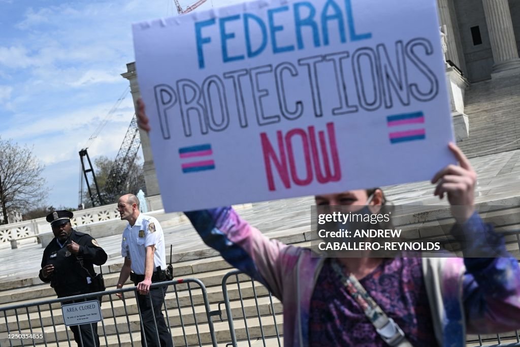Trans Rights Demonstration Us An activist holds a sign calling for federal protections of... News ...