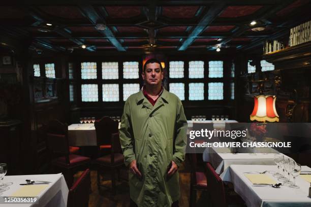 Writer Jake Adelstein poses during a photo session at Le Cintra bar during the "Quais du Polar" crime fiction literature festival in Lyon,...