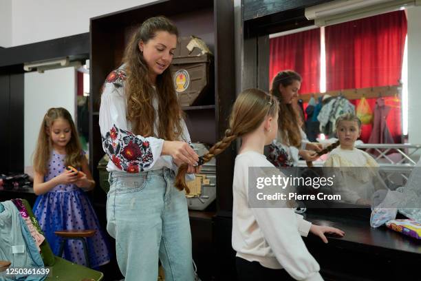 Ukrainian prepares to perform a song during a song and music contest organised by Ukrainian war refugees in the cultural centre on April 1, 2023 in...