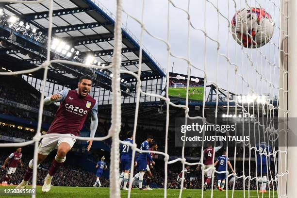 Aston Villa's Argentinian midfielder Emiliano Buendia celebrates following the second goal of his team scored by Aston Villa's Scottish midfielder...