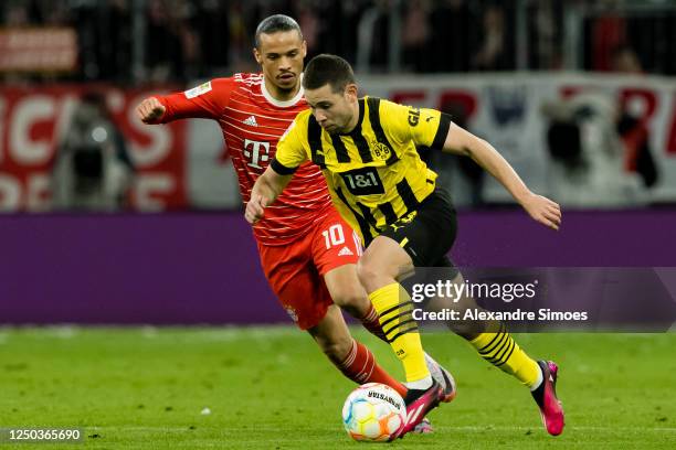 Raphael Guerreiro of Borussia Dortmund and Leroy Sané of FC Bayern München during the Bundesliga match between FC Bayern München and Borussia...