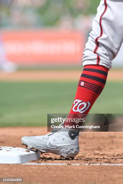 Detailed view of the Stance brand socks and Nike shoes worn by Victor Robles of the Washington Nationals while running the bases during the Spring...