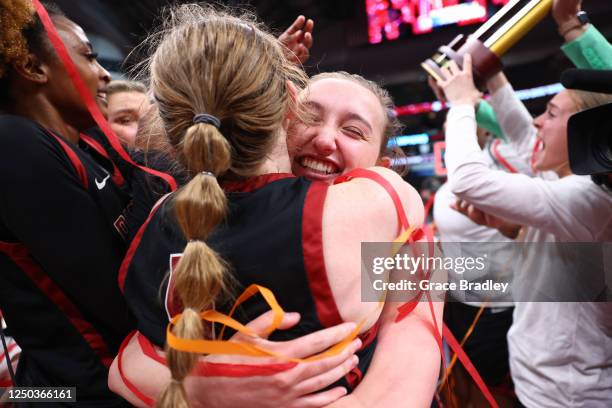 Sadie Wurth of Transylvania Pioneers celebrates with Madison Kellione of Transylvania Pioneers after during the Division III Womens Basketball...