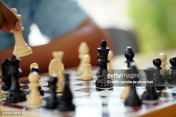 close-up businessman playing chess . - strategy stock pictures, royalty-free photos & images