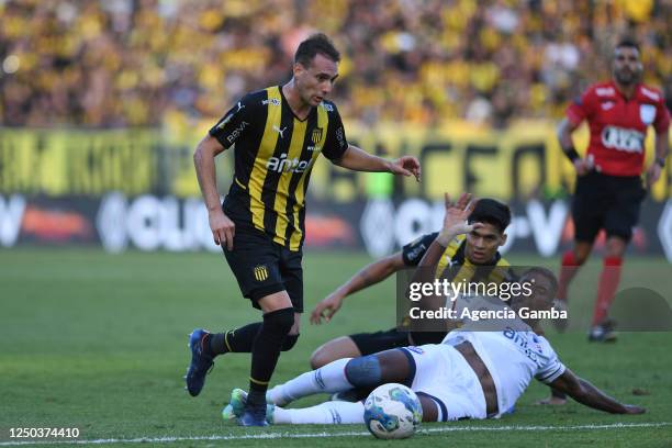 Sebastian Cristóforo of Peñarol and Marcos Montiel of Nacional fight for the ball during the Torneo Apertura 2023 match between Peñarol and Nacional...