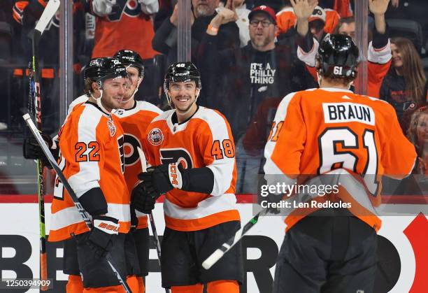 Morgan Frost of the Philadelphia Flyers celebrates his first period goal against the Buffalo Sabres with Brendan Lemieux, Nick Seeler, and Justin...