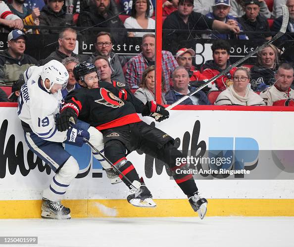 Toronto Maple Mathiue Mathieu Joseph of the Ottawa Senators gets tangled up with Calle ...