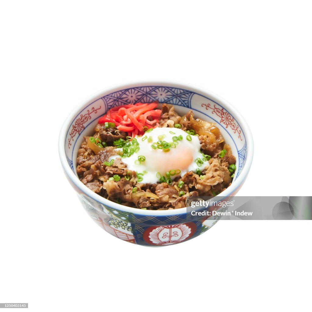 Gyudon beef bowl with onsen egg and beni shoga, isolated on white background with clipping path