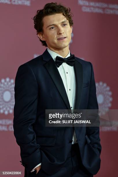 In this picture taken on April 1 Hollywood actor Tom Holland poses for pictures during the inauguration of the Nita Mukesh Ambani Cultural Centre at...