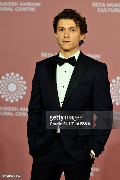 In this picture taken on April 1 Hollywood actor Tom Holland poses for pictures during the inauguration of the Nita Mukesh Ambani Cultural Centre at...