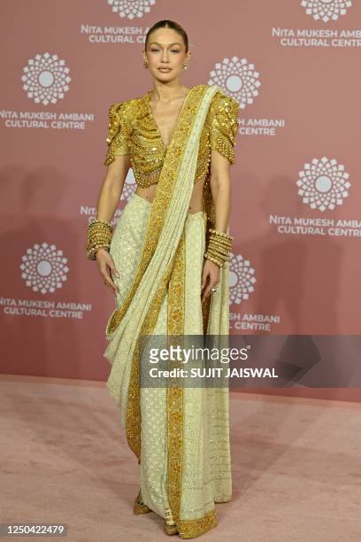 In this picture taken on April 1 US model Gigi Hadid poses for pictures during the inauguration of the Nita Mukesh Ambani Cultural Centre at the Jio...