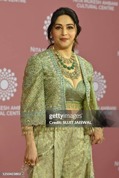 In this picture taken on April 1 Bollywood actress Madhuri Dixit poses for pictures during the inauguration of the Nita Mukesh Ambani Cultural Centre...