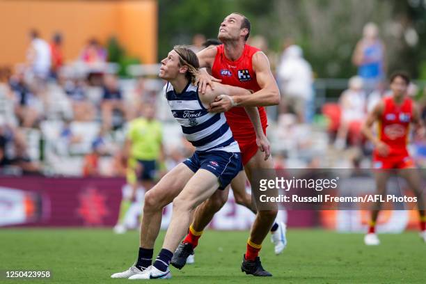 Mark Blicavs of the Cats and Jarrod Witts of the Suns contest the ruck during the 2023 AFL Round 03 match between the Gold Coast Suns and the Geelong...