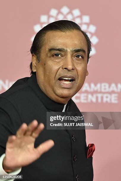 In this picture taken on April 1 Chairman and managing director of Reliance Industries Mukesh Ambani poses for pictures during the inauguration of...