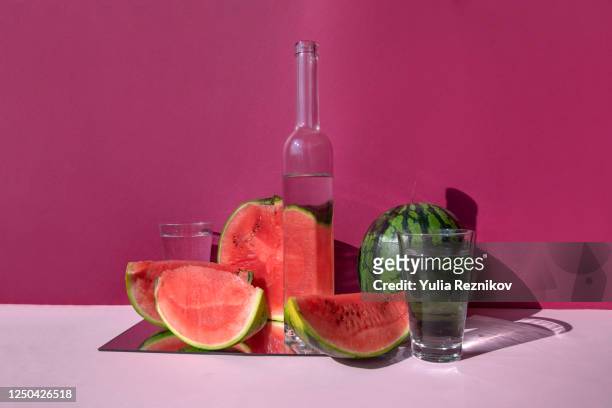 watermelon and glasses on the pink background - still life foto e immagini stock