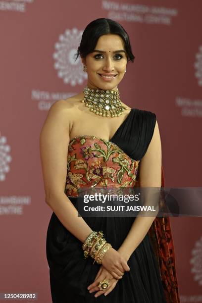 In this picture taken on April 1 Bollywood actress Shradhha Kapoor poses for pictures during the inauguration of the Nita Mukesh Ambani Cultural...