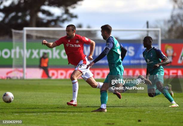 Bassala Sambou of Oldham Athletic Association Football Club tussles with Eoghan O'Connell of Wrexham Football Club during the Vanarama National...