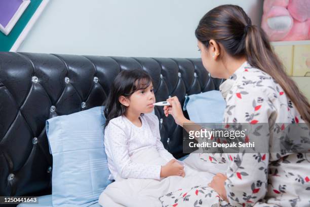 sick child with high fever stock photo - illness stock pictures, royalty-free photos & images