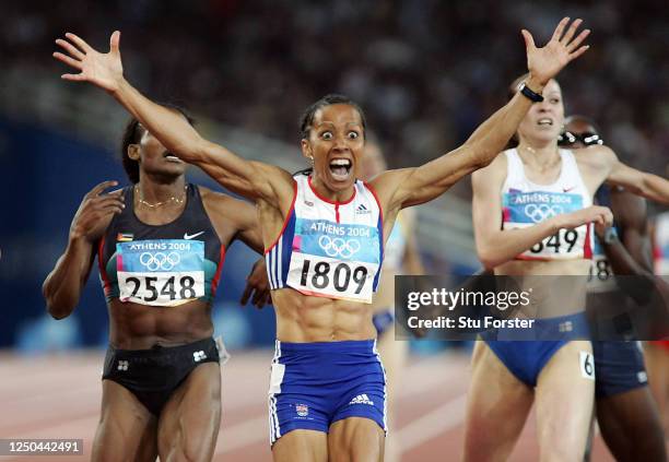 Kelly Holmes of Great Britain celebrates after she won gold in the women's 800 metre final on August 23, 2004 during the Athens 2004 Summer Olympic...