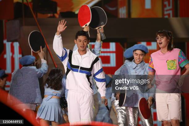 Table tennis player Zhang Jike and swimmer Fu Yuanhui perform on stage during a gala held by Hunan Satellite TV and Pinduoduo on June 17, 2020 in...