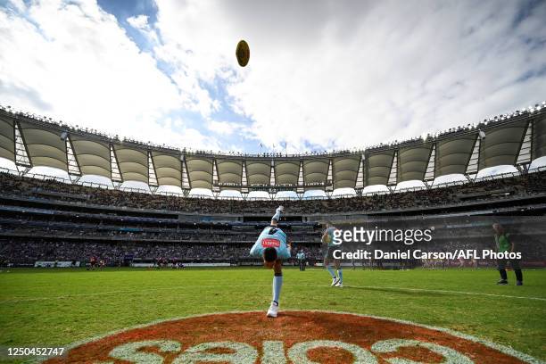 The umpire bounces the ball during the 2023 AFL Round 03 match between the Fremantle Dockers and the West Coast Eagles at Optus Stadium on April 2,...